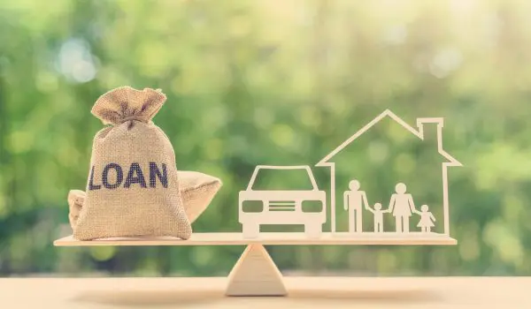 Family Financial Management, Mortgage And Payday Loan Or Cash Advance Concept : Loan Bags, Family In A House On Balance Scale, Depicts Short Term Borrowing, High Interest Rate Based On Credit Profile