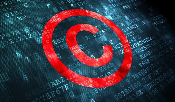 A prominent red copyright symbol overlays a digital background filled with alphanumeric code.