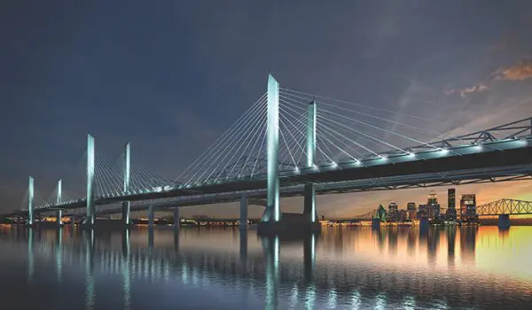 Cable suspension bridge over a river at night