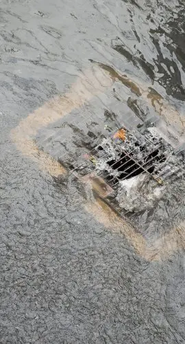 Flood After The Rain Is Flowing Down The Drain On The Road