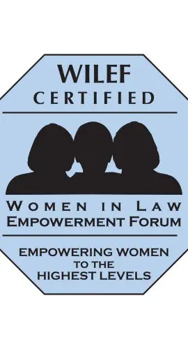 A blue octagonal emblem featuring the text "WILEF Certified - Women in Law Empowerment Forum - Empowering Women to the Highest Levels" along with silhouettes of three women.