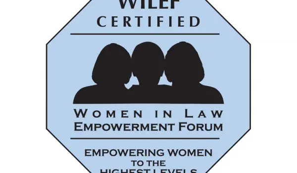 A blue octagonal emblem featuring the text "WILEF Certified - Women in Law Empowerment Forum - Empowering Women to the Highest Levels" along with silhouettes of three women.
