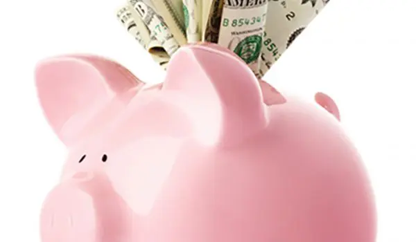 Piggy bank overflowing with money
