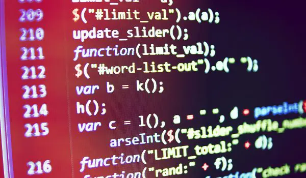 A close-up of a computer screen displaying colorful programming code in a development environment.