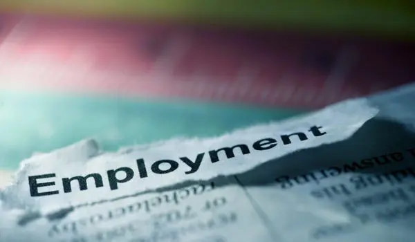 A torn piece of paper with the word "Employment" printed on it is prominently displayed.