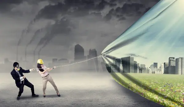 Two individuals are pulling back a curtain to reveal a green and vibrant cityscape behind a polluted, smoky environment.