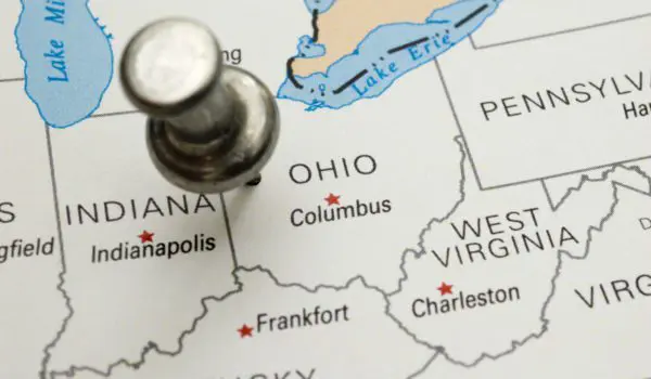 A pushpin is placed on a map marking Columbus, Ohio, with surrounding states and cities labeled.