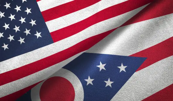 Two flags, one of the United States and one of Ohio, are shown overlapping.