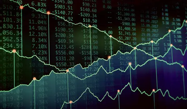 A series of fluctuating financial graphs and numerical data overlaying a dark background, likely representing stock market information.
