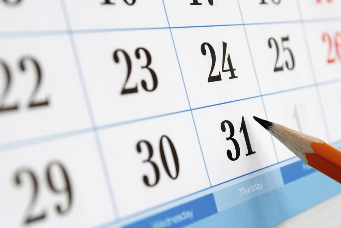 A close-up of a calendar page shows dates with a pencil pointing to the 31st.