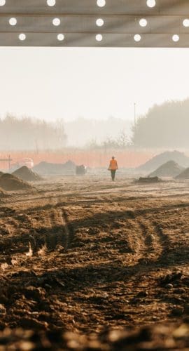 Frame structure at under construction site on rural landscape