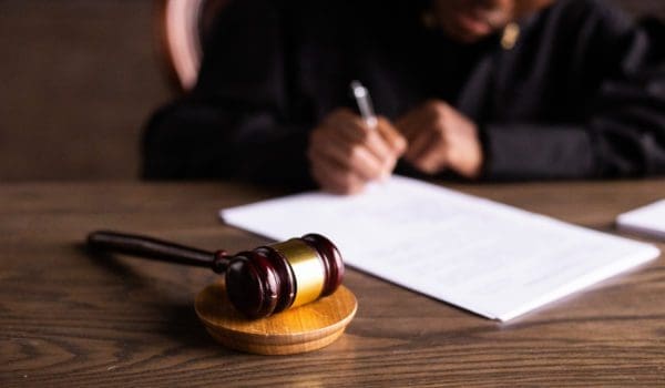 Judge signing on the papers