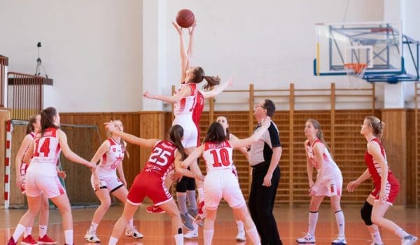 Women playing basketball