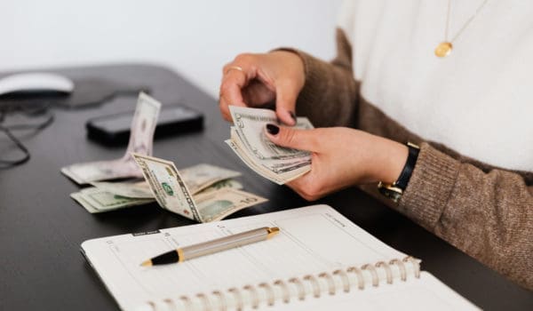 Person counting cash money