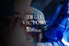FBT logo imposed over welder in factory