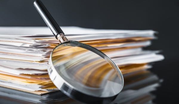 File Stack and Magnifying Glass