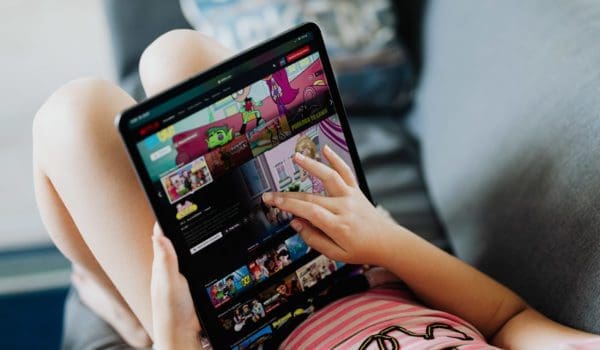 Little girl holding a tablet