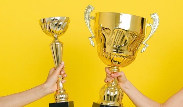 People holding trophies