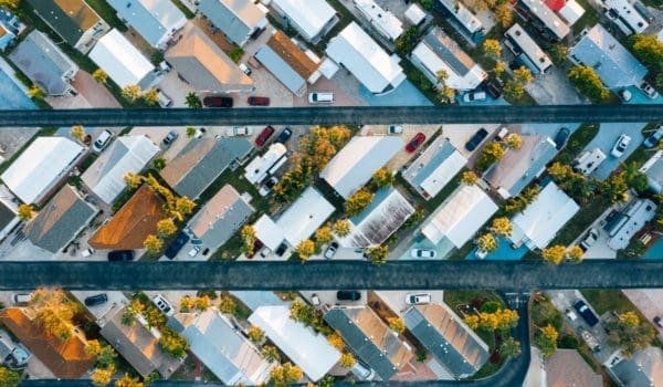 Houses and vehicles near horizontal roads in suburb