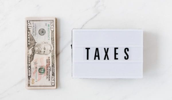 American dollar bills and vintage light box with inscription