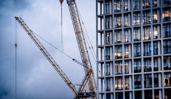 Construction tower cranes on a building site
