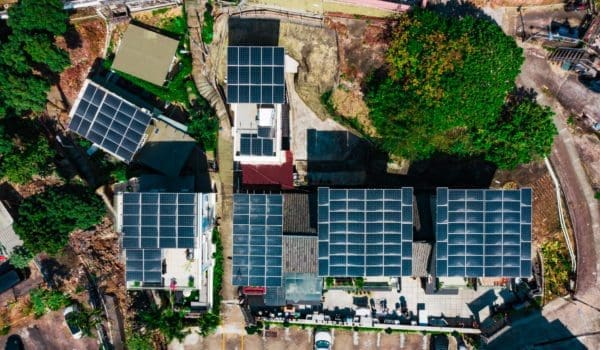 Solar panels on the gable roof of the rustic house