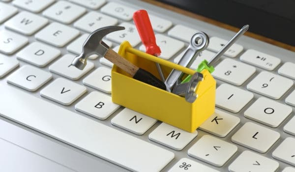 tools on the keyboard of a latop, 3d rendering,conceptual image. service  and support concepts.