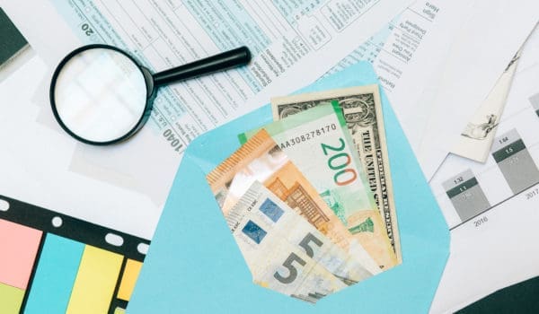 Money inside blue envelope