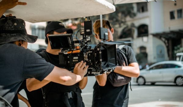 Photo of man holding camera