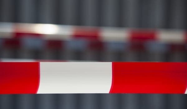 Red tape against dark background. Exclusion zone. Adobe RGB for better color reproduction.