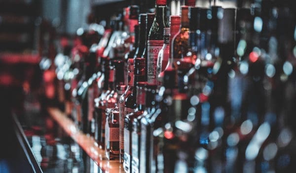 Selective focus photo of alcohol bottles