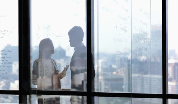 Silhouette shadows of business people talking in office
