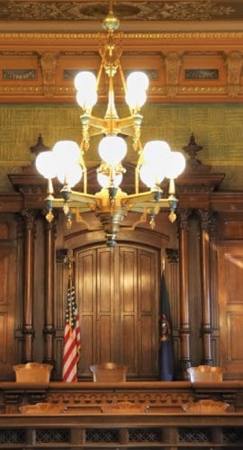 The chamber of the Supreme Court, located in the Capitol building in Lansing, Michigan.