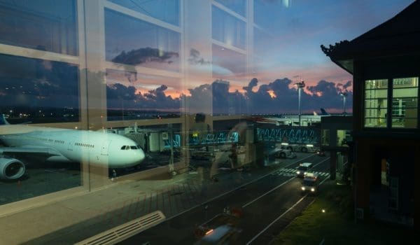 Aircraft on airfield through terminal window