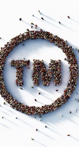 Human crowd forming trademark symbol on white background. Horizontal composition with copy space.