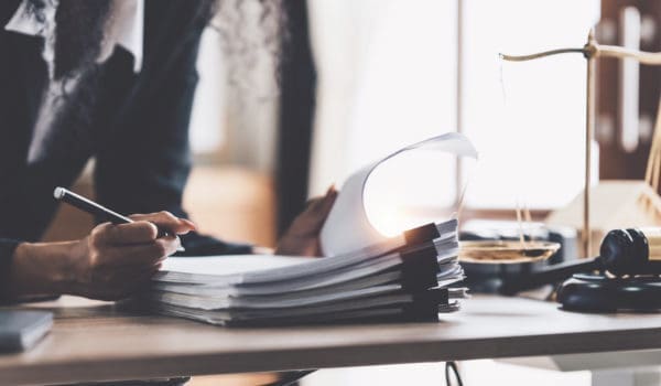 Lawyer business woman working or reading lawbook in office workplace for consultant lawyer concept.