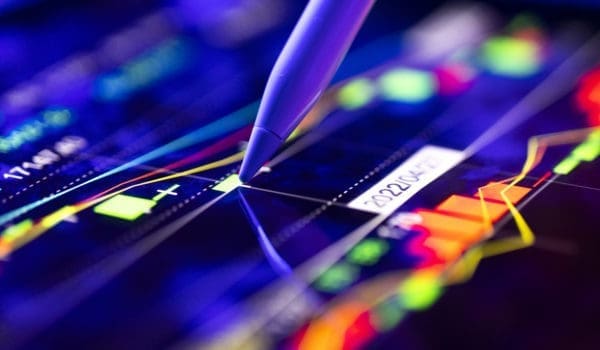 Person analyzing the market trends on a digital screen