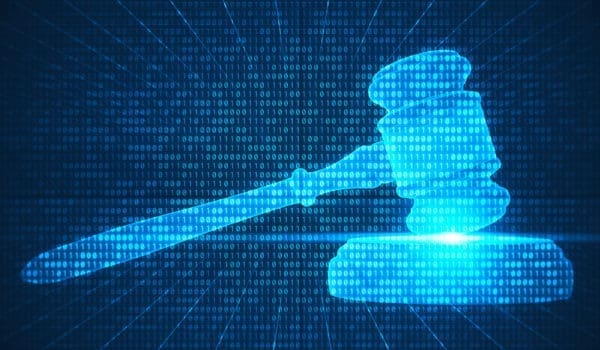 Abstract digital composite of gavel and binary codes.