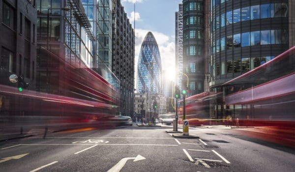 Buses on the street at the financial district of London.