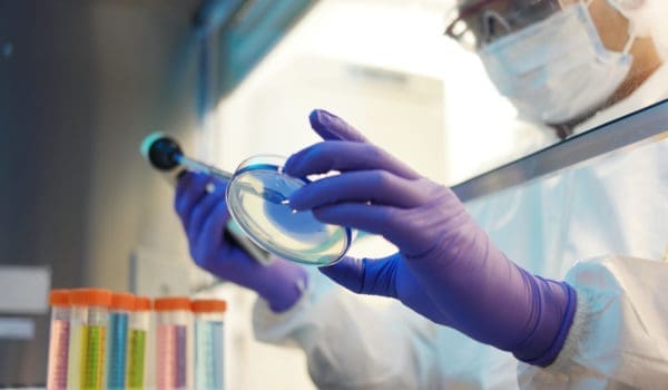 Male scientist in a cleanroom laboratory