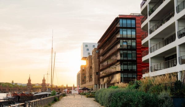 New residential neighbourhood on the background of old architecture in Berlin in summer at sunset