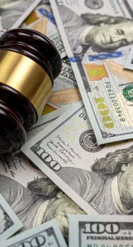 judge gavel and 100 dollar bills as background. Judge and money concept. Corruption