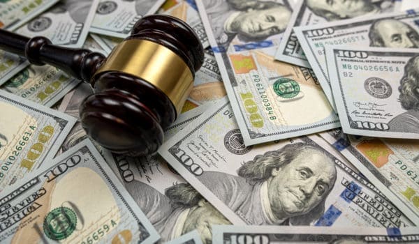 judge gavel and 100 dollar bills as background. Judge and money concept. Corruption