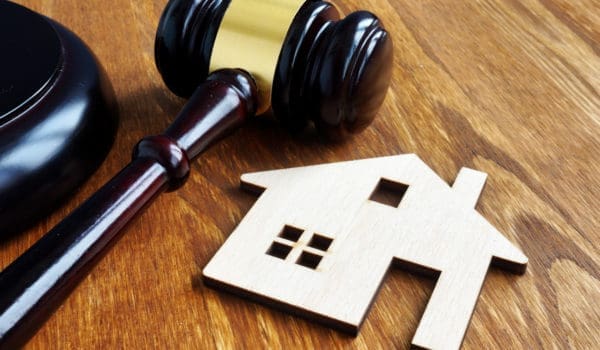 Real estate and property law. House model and gavel.