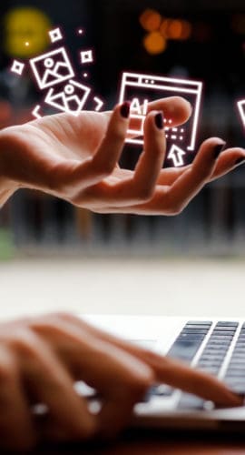 Woman holding ai icons with laptop