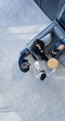 Business people, high angle and meeting in building with collaboration, financial pitch with document for strategy. Above, tax accountant and table teamwork with budget paper for economy in office
