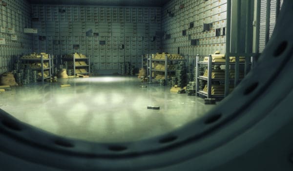 Bank vaulted door with safety deposit boxes.