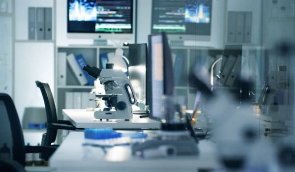 Scientific, research and medical labratory where scientists conduct experiments and do analysis. Empty lab with microscope and science equipment technology for learning and testing for biochemistry